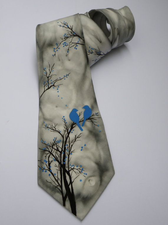 Apgleznota kaklasaite Zilie putniņi